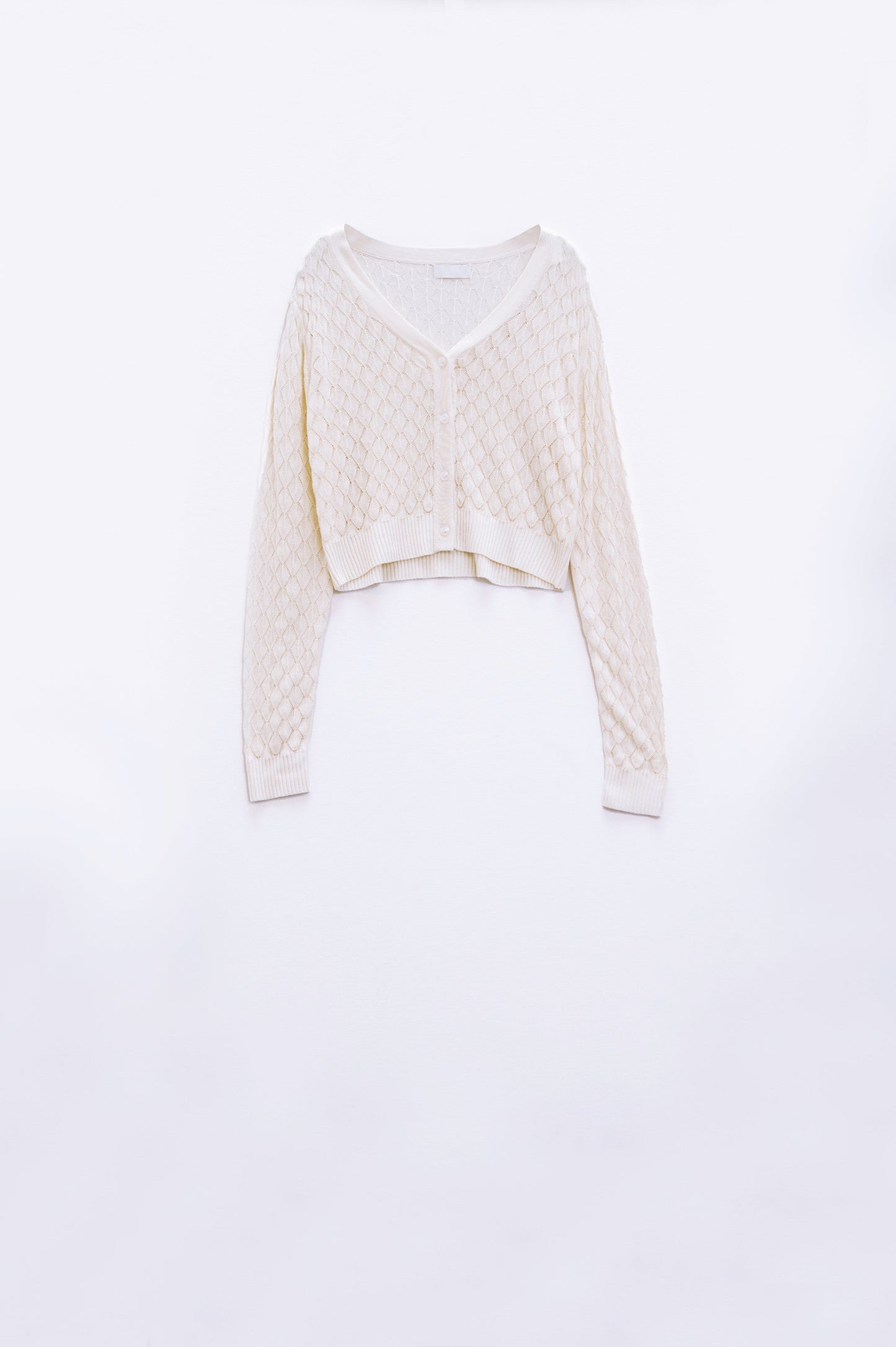 Cárdigan corto beige con estampado de rombos Q2