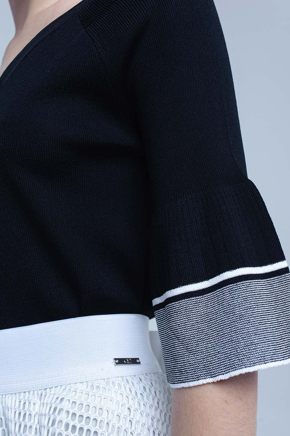 Jersey de punto negro con manga de campana Q2