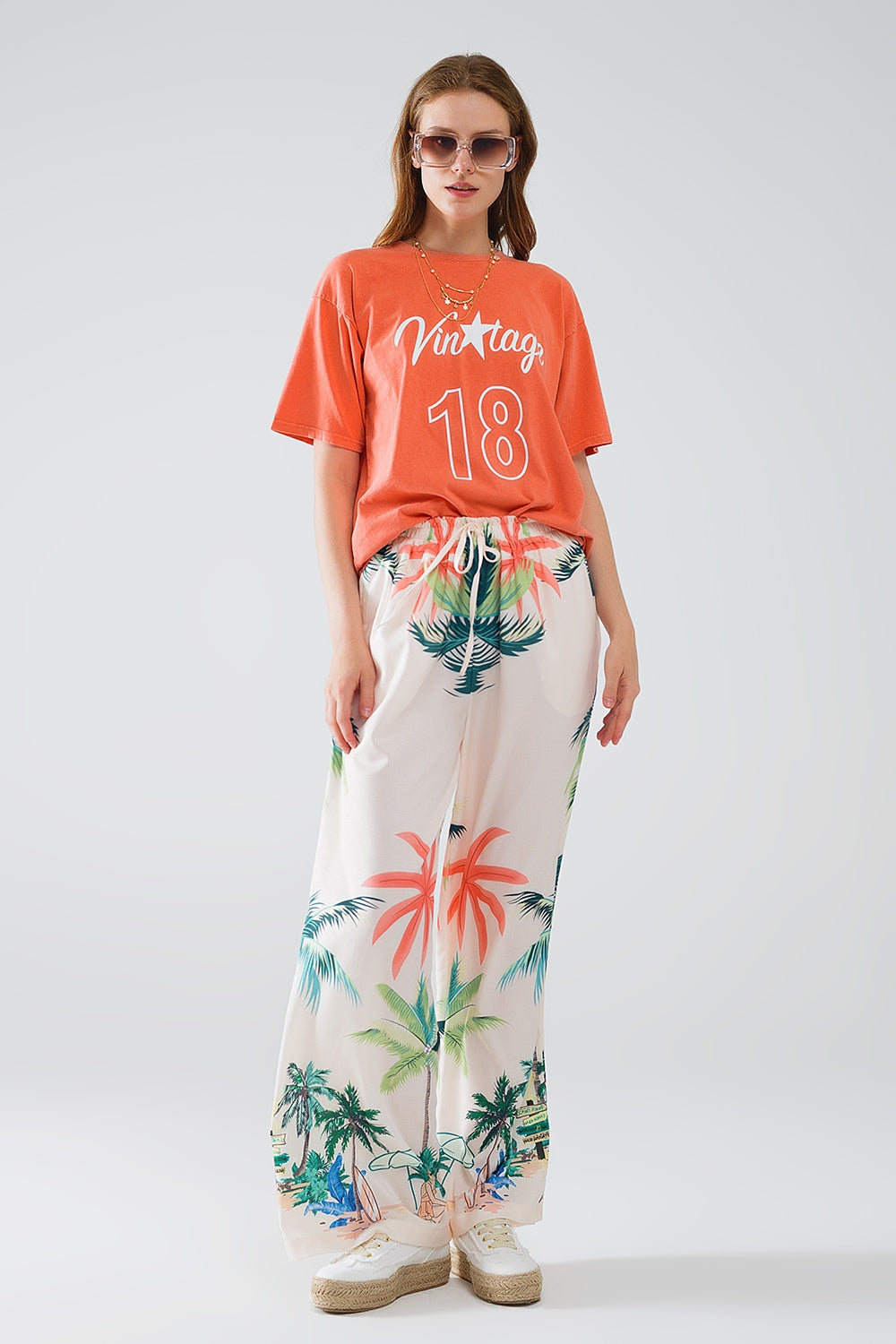 Pantalón recto crema con estampado playero y cintura elástica Q2