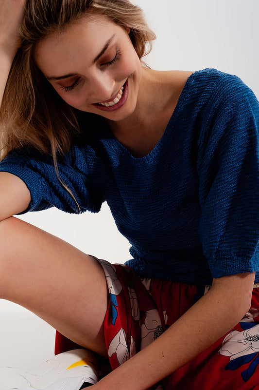 Q2 Top color azul de punto con manga corta