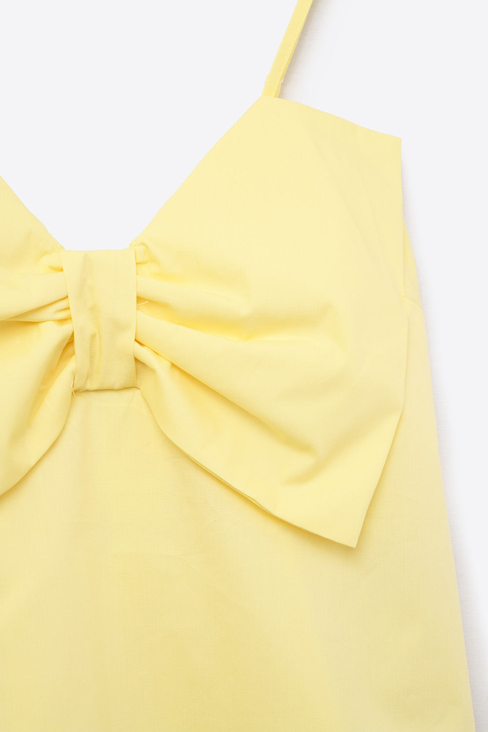Top de popelín amarillo con detalle de lazo Q2