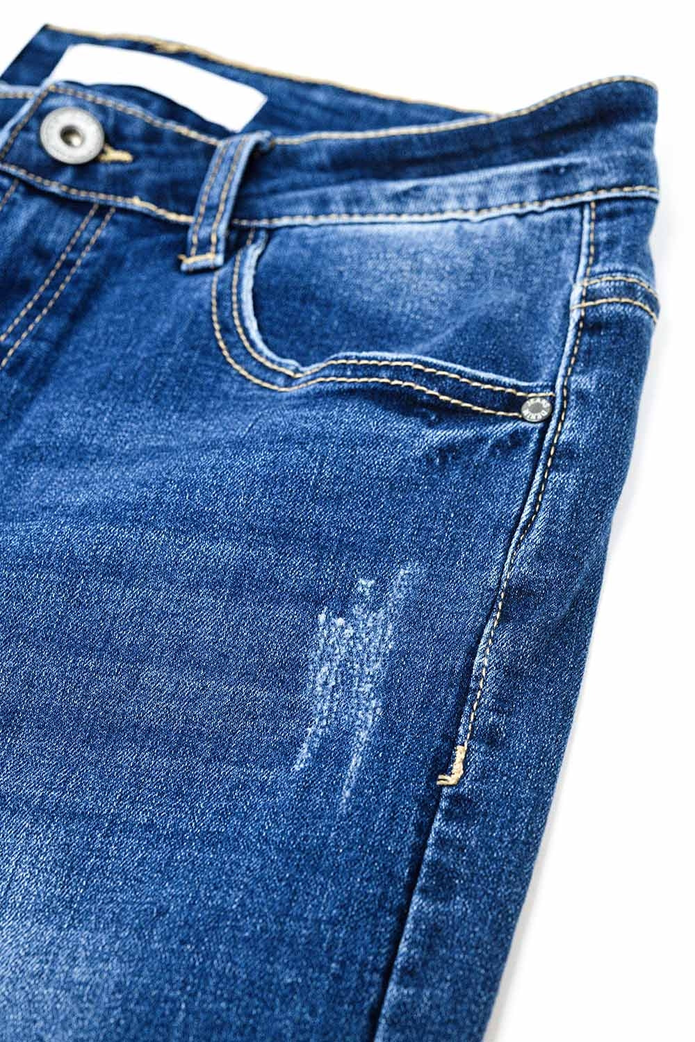 Vaqueros super skinny en lavado medio con rotos en los bajos Q2