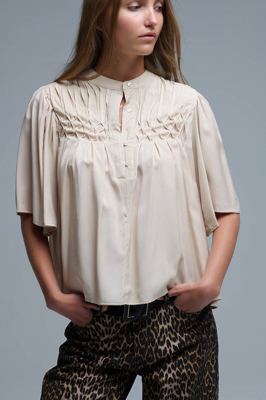 Q2 Blusa relajada beige de estilo boho con detalles bordados