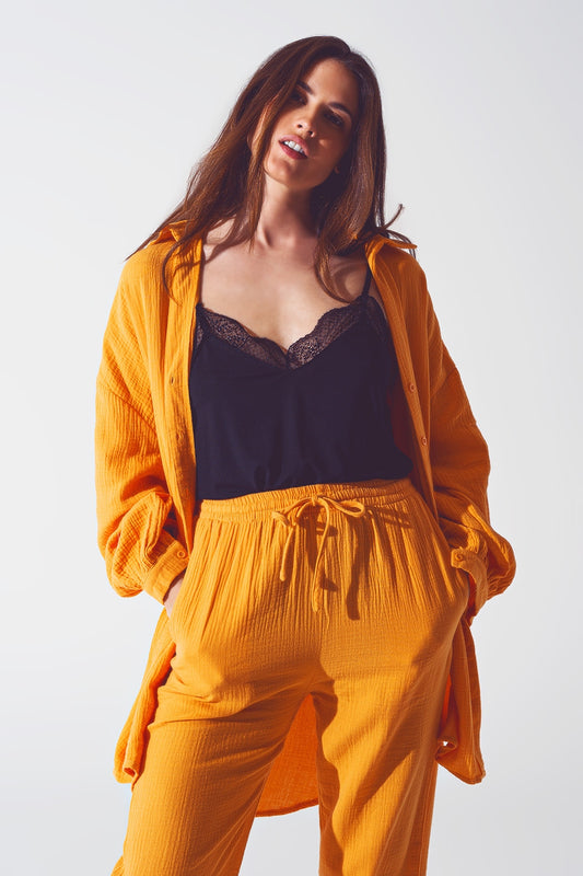 Q2 Camisa holgada con textura en naranja