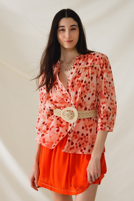 Q2 Camisa naranja con estampado abstracto y mangas 3/4