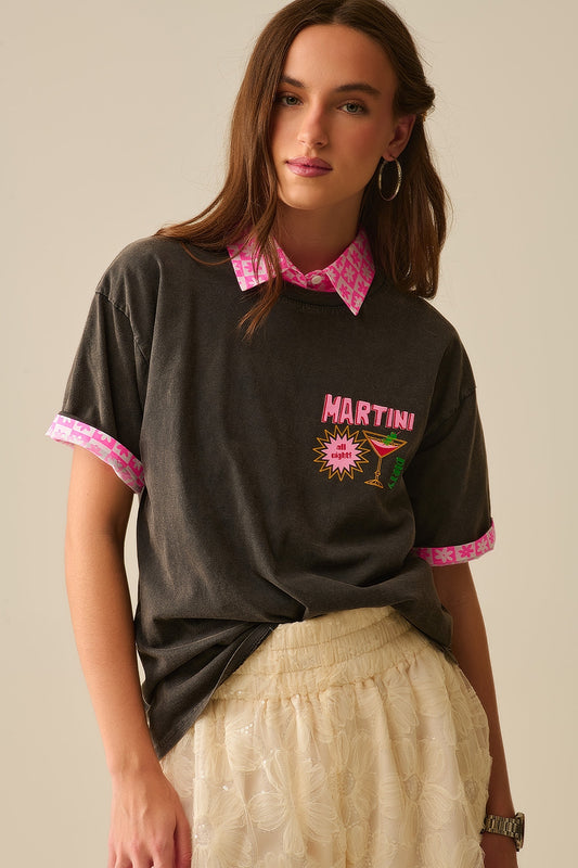 Q2 camiseta negra lavada a la piedra fabricada en Italia con logotipo gráfico Martini