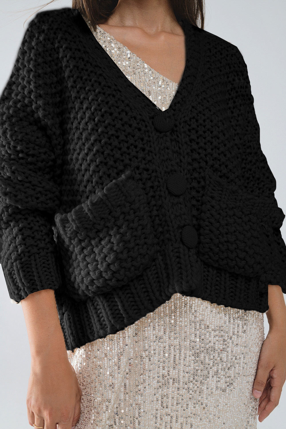 Chaqueta negra oversize de punto grueso con bolsillos Q2