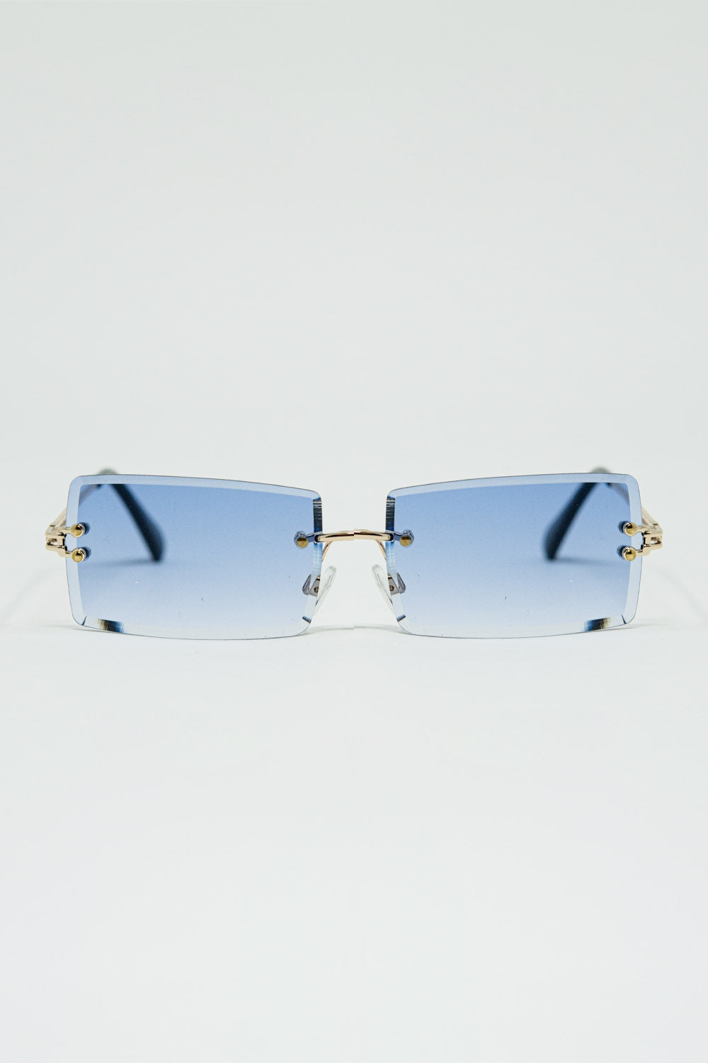 Gafas de sol cuadradas doradas sin montura con lentes moradas Q2