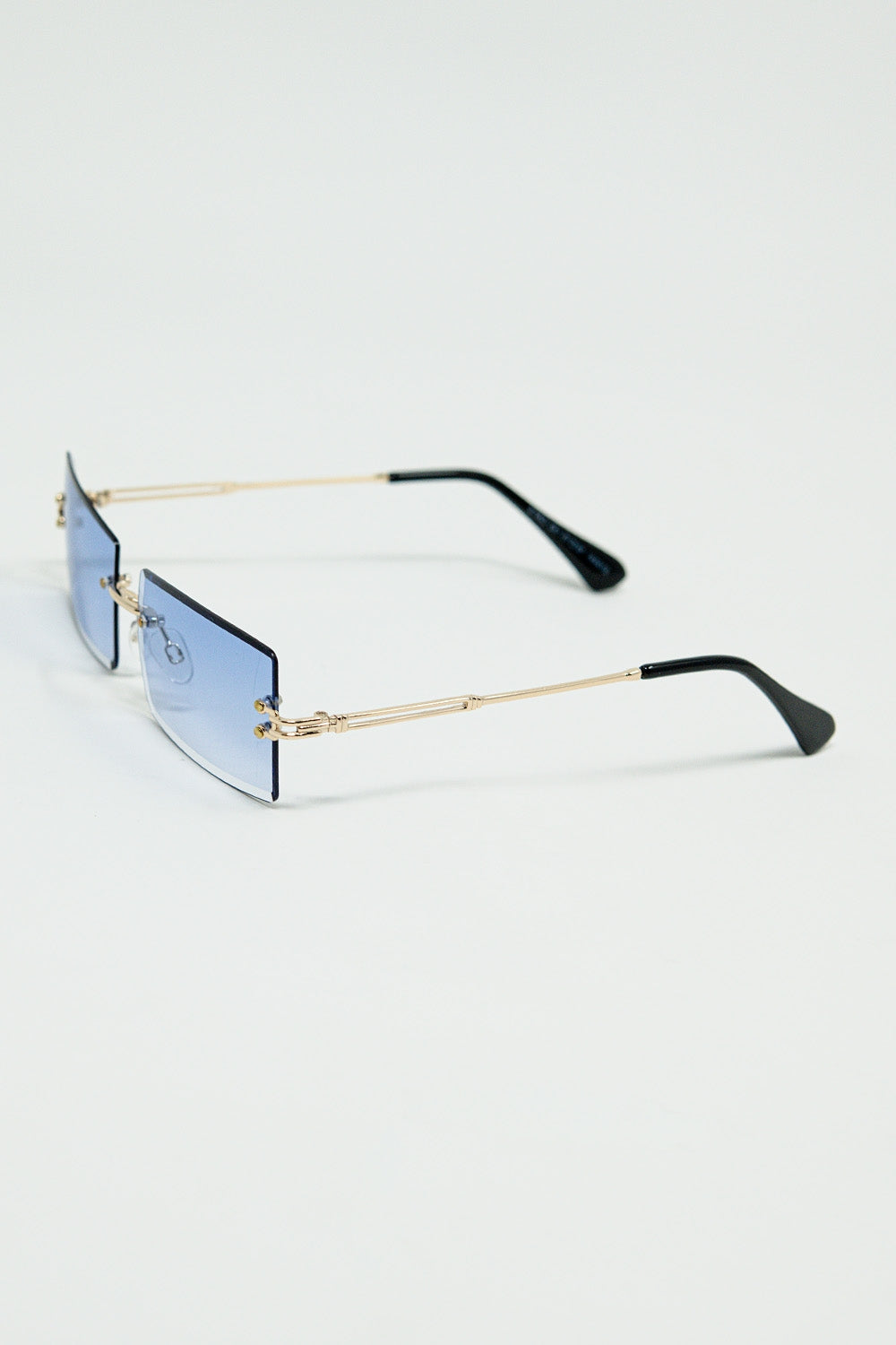 Gafas de sol cuadradas doradas sin montura con lentes moradas Q2