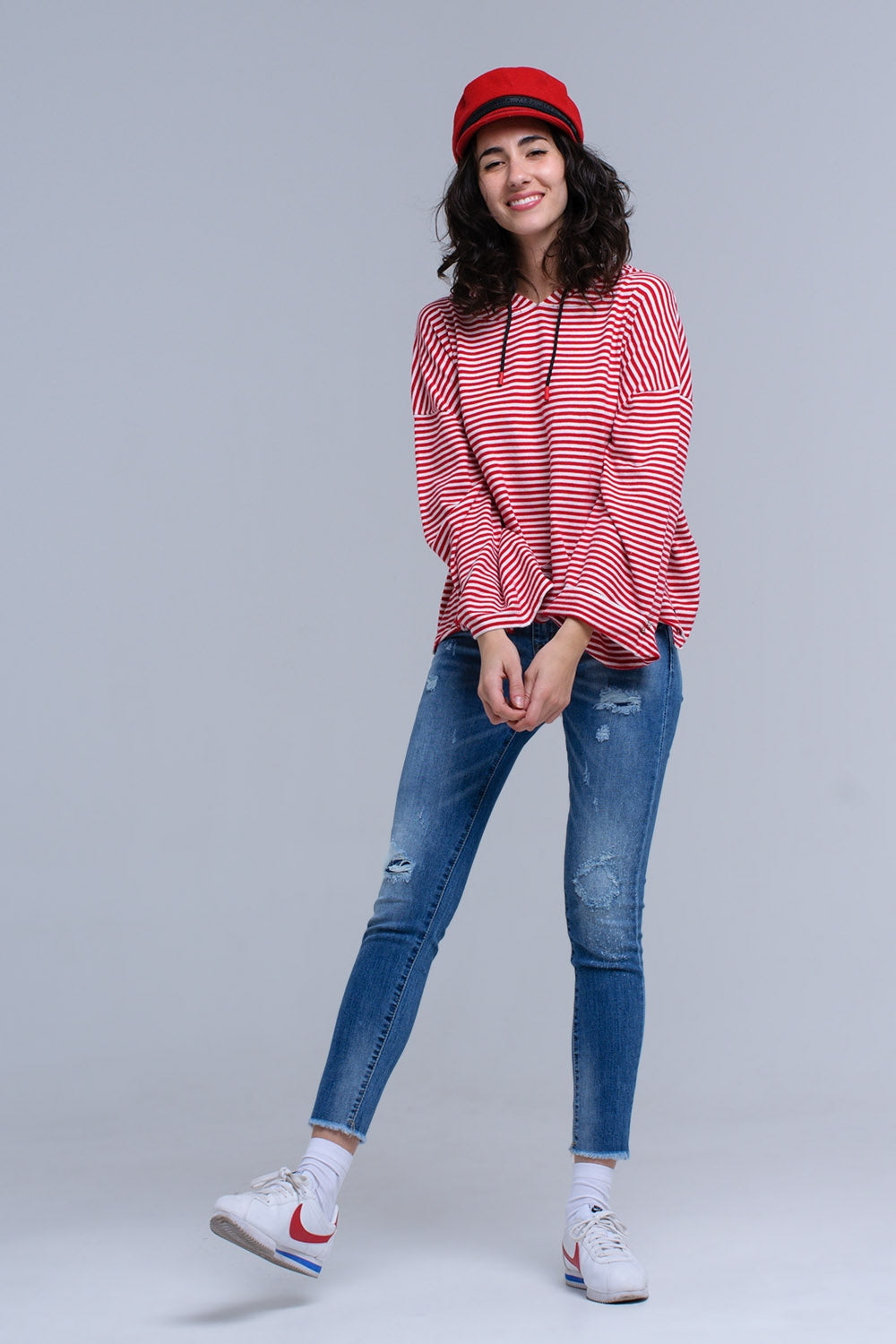 Jeans ajustados y desgastados con flecos Q2