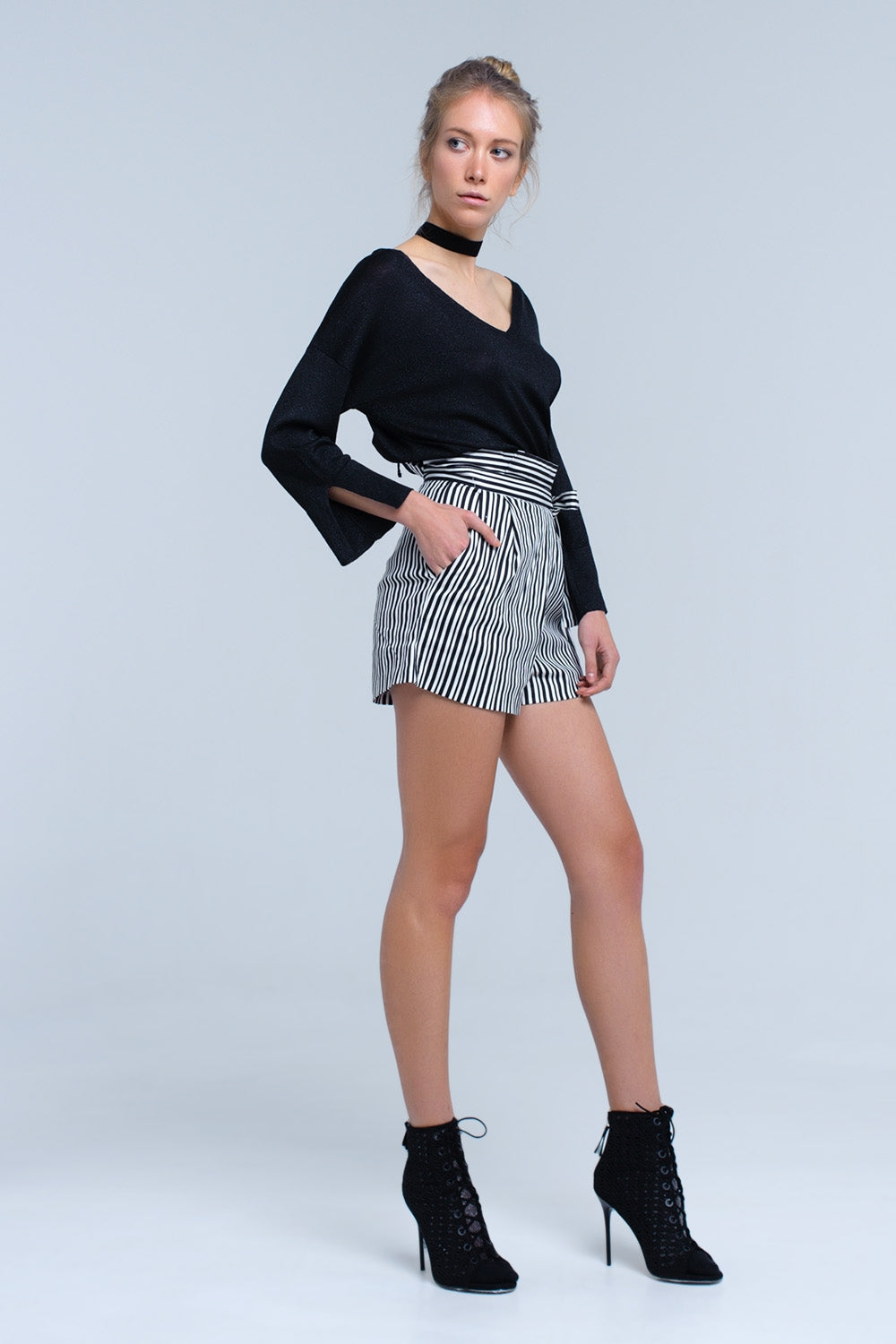 Jersey de punto negro con detalle de lurex dorado Q2