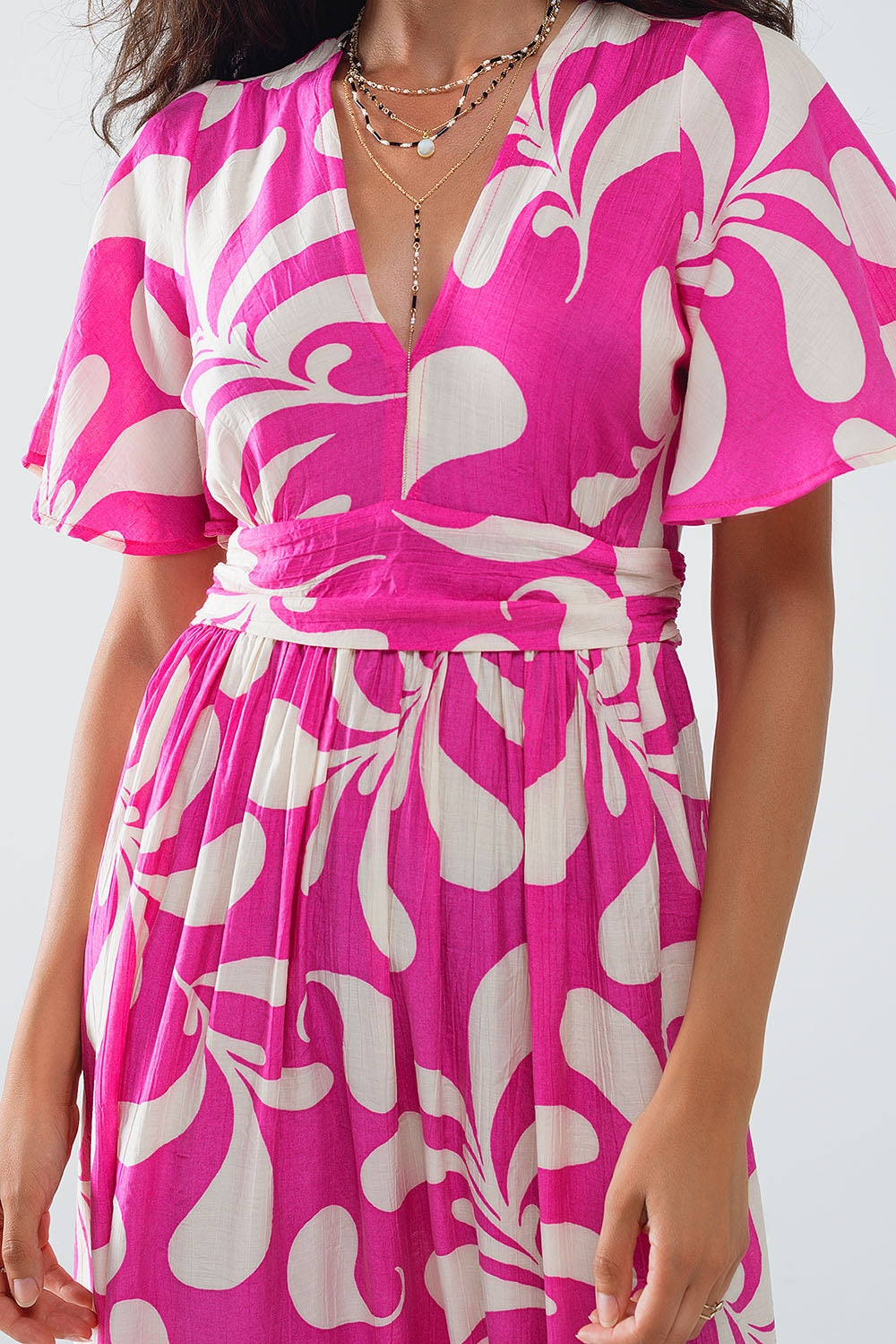 Maxivestido fucsia con estampado floral y espalda abierta Q2