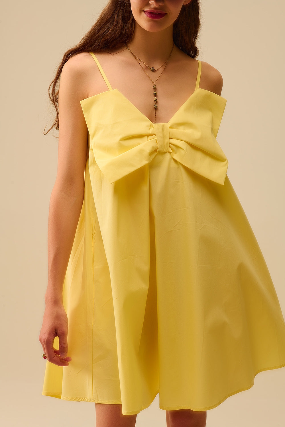 Minivestido de popelín amarillo con detalle de gran lazo Q2