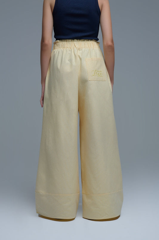Pantalón palazzo amarillo a rayas con pernera extra ancha Q2