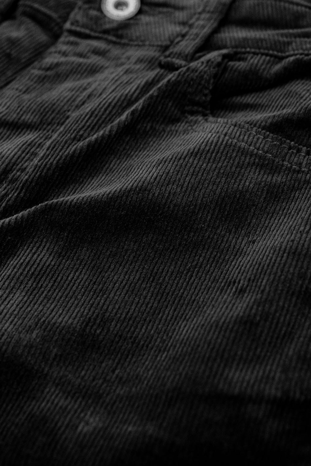 Pantalones acampanados de pana negra con estampado de leopardo en el bajo Q2