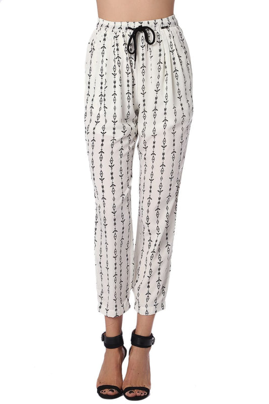 Q2 Pantalones crema con estampado azteca en contraste