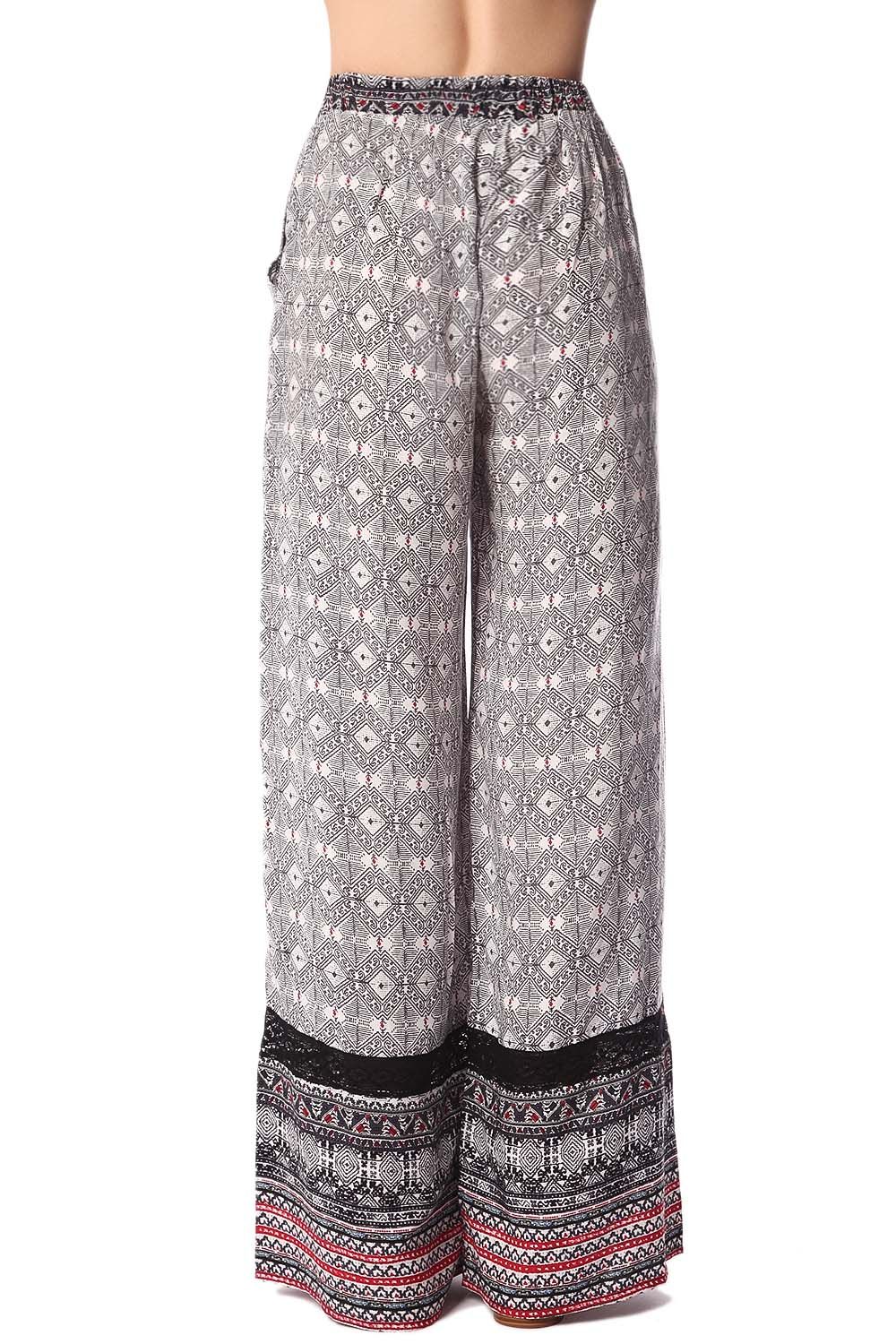 Pantalones de pernera amplia con estampado etnico negro y detalle de puntilla Q2