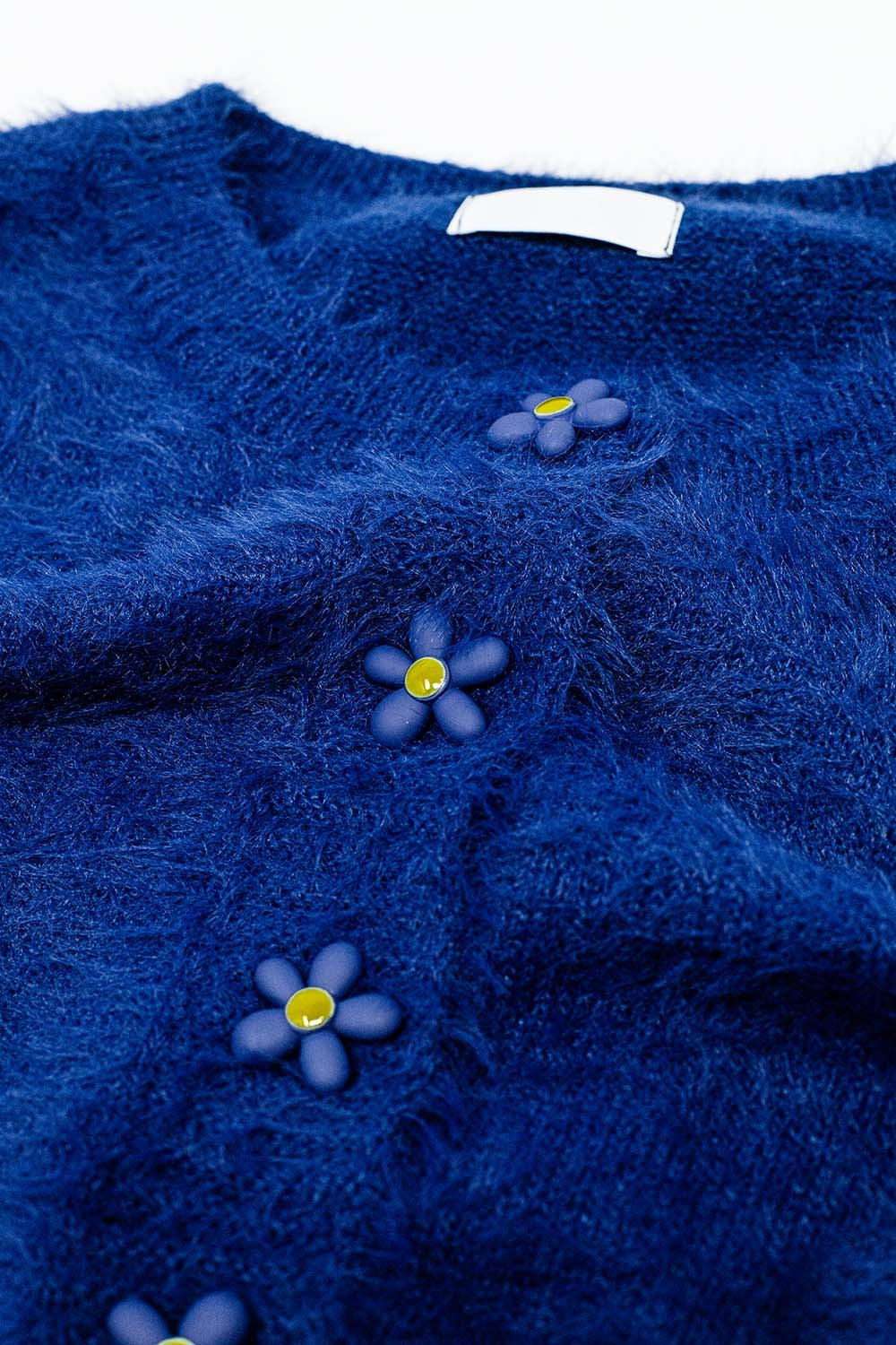 Rebeca corta y esponjosa azul marino con botones de flores Q2