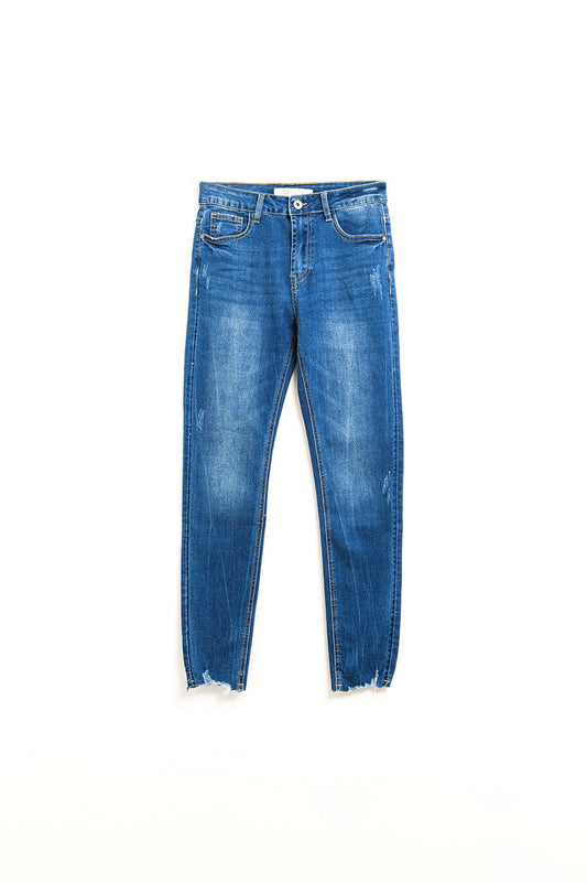 Q2 Vaqueros super skinny en lavado medio con rotos en los bajos